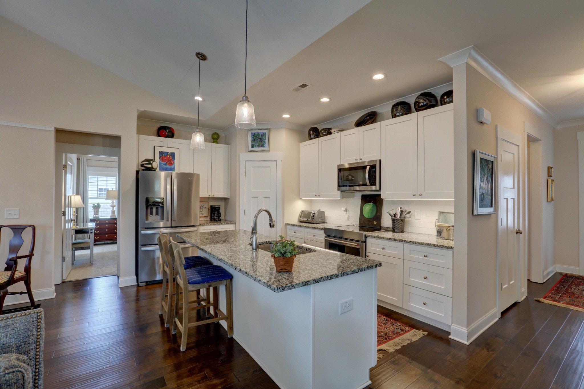 Professional HDR interior photograph of a bright residential kitchen